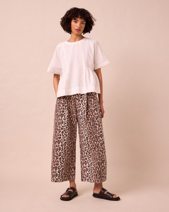 model wears bonnie leopard print denim jeans left