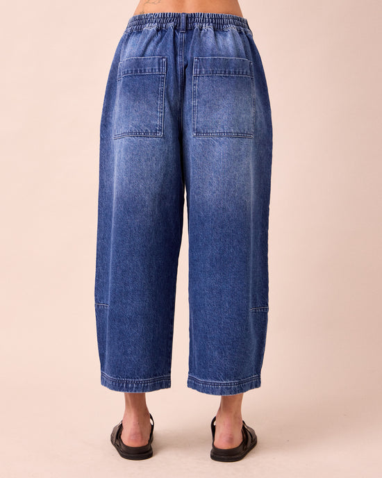 model wears bonnie mid blue denim jeans back