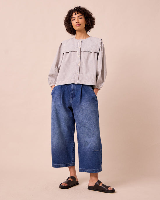 model wears bonnie mid blue denim jeans left