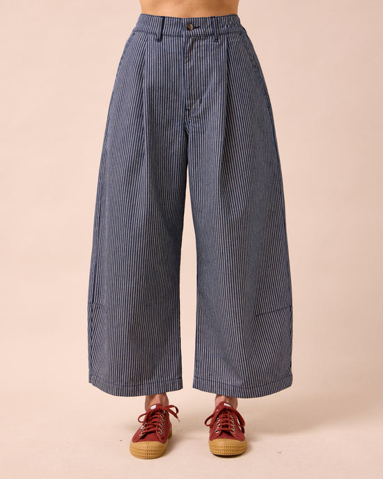 model wears bonnie navy pinstripe denim jeans front