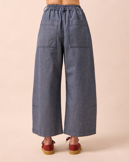 model wears bonnie navy pinstripe denim jeans back