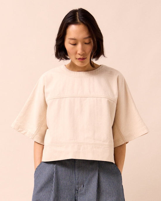 model wears eva ecru denim top