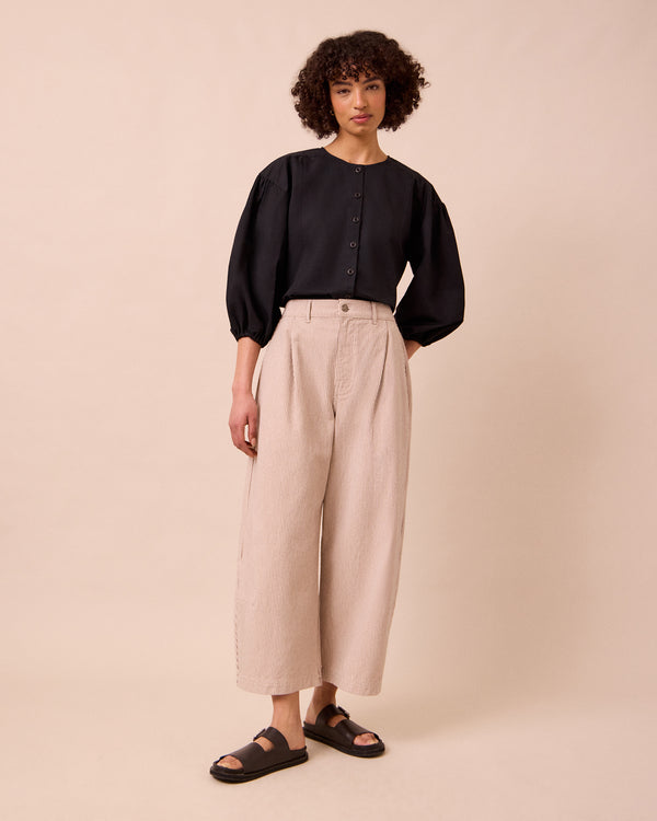 model wears bonnie shell hickory stripe denim jeans left