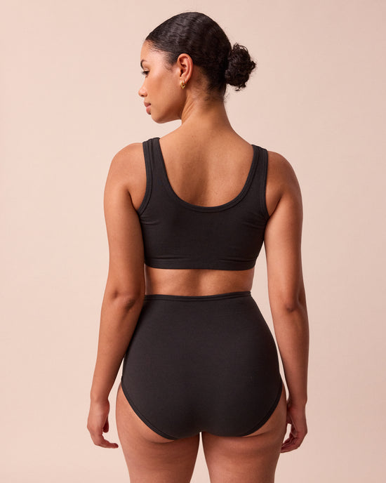 model wears black jersey bralette