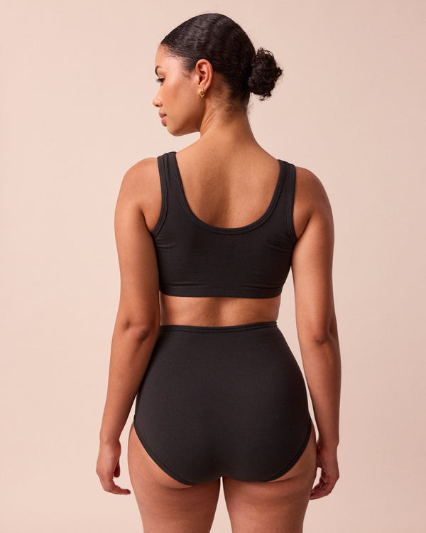 model wears black jersey bralette