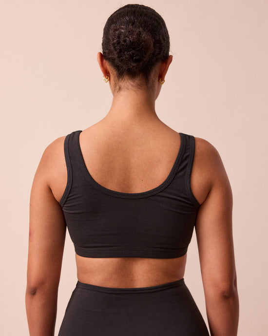 model wears black jersey bralette