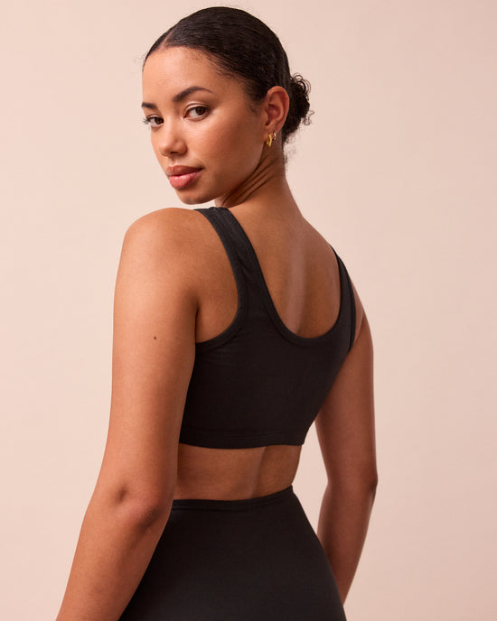 model wears black jersey bralette