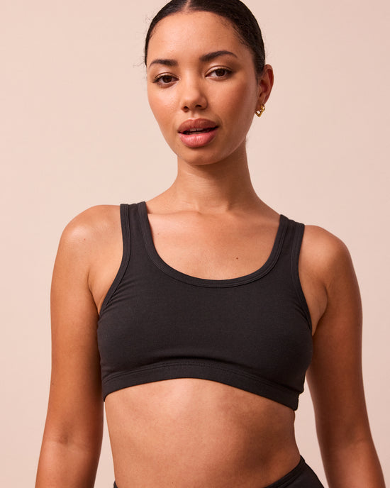 model wears black jersey bralette