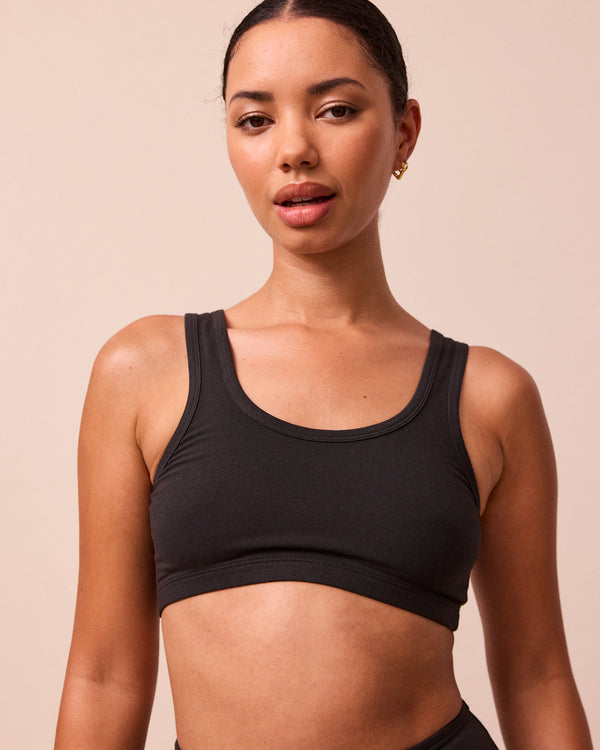 model wears black jersey bralette