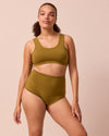 model wears golden olive jersey bra