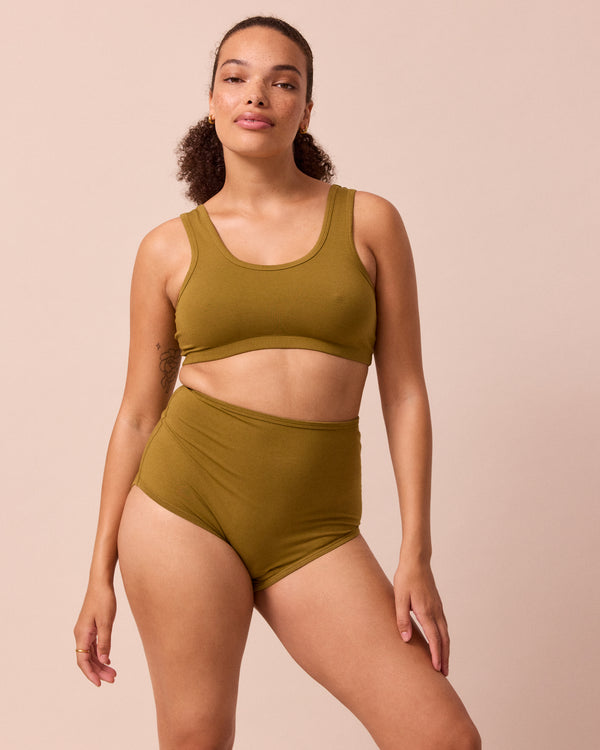 model wears golden olive jersey bra