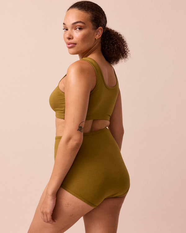 model wears golden olive jersey bra