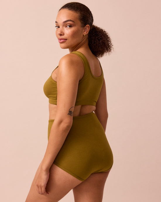 model wears golden olive full coverage jersey knicker