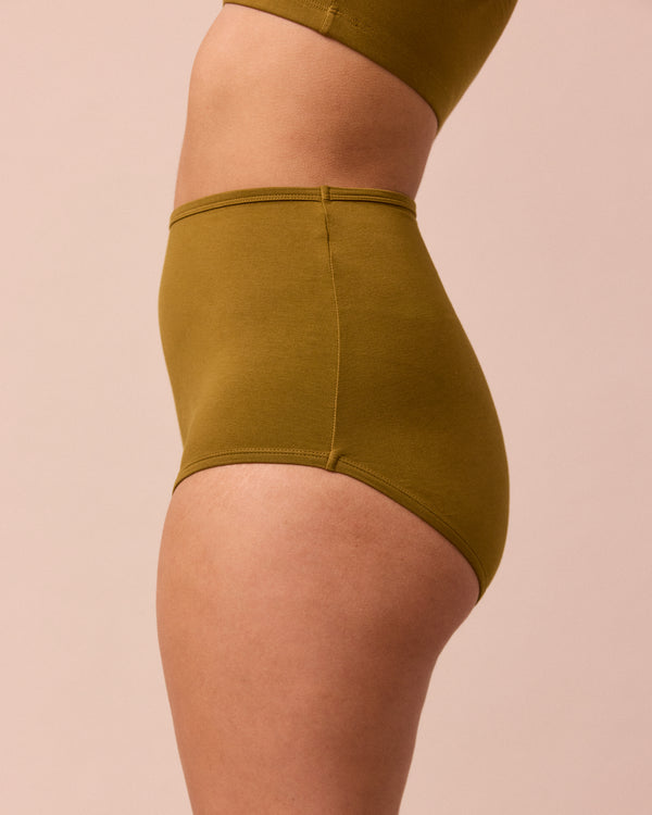 model wears golden olive full coverage jersey knicker