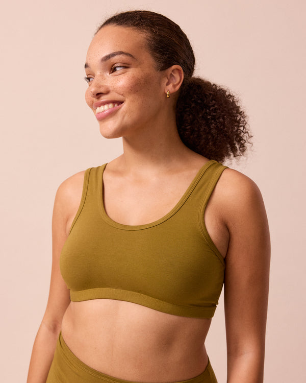 model wears golden olive jersey bra