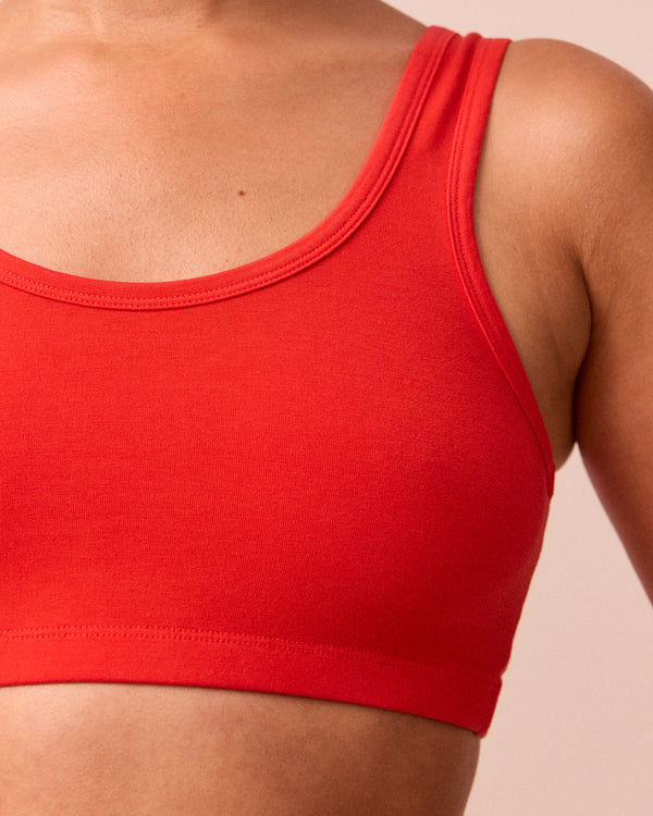 model wears tomato red jersey bralette