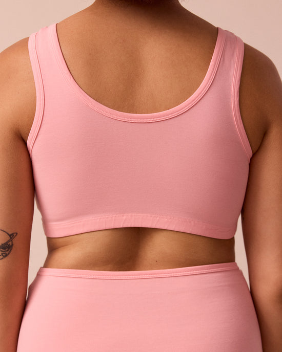 model wears petal pink jersey bralette