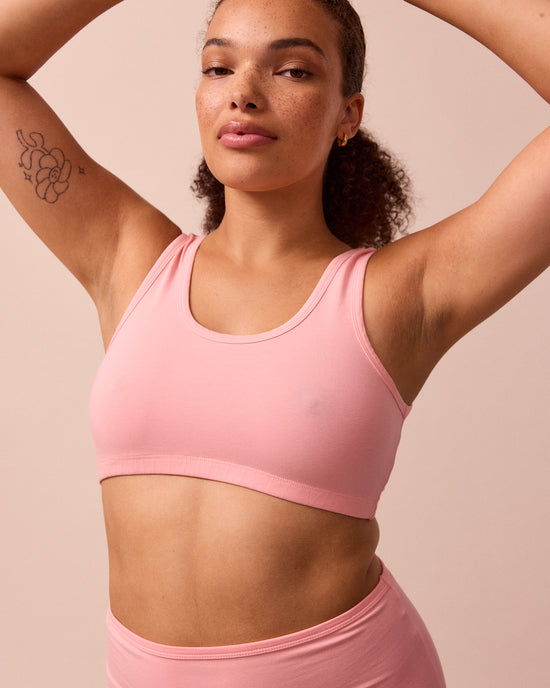model wears petal pink jersey bralette