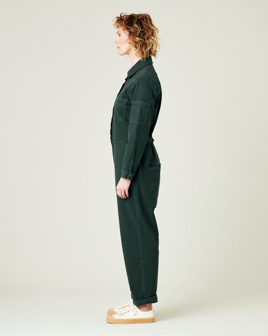 model wears bottle green coverall