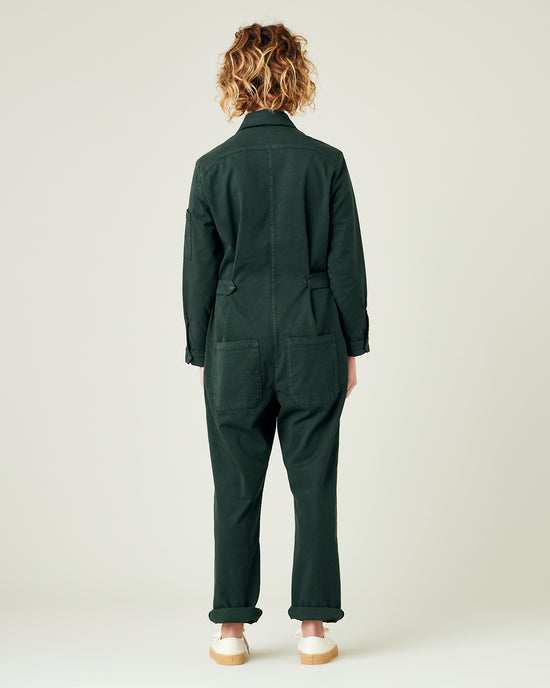 model wears bottle green coverall