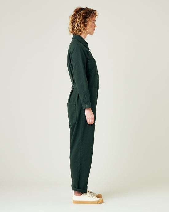 model wears bottle green coverall