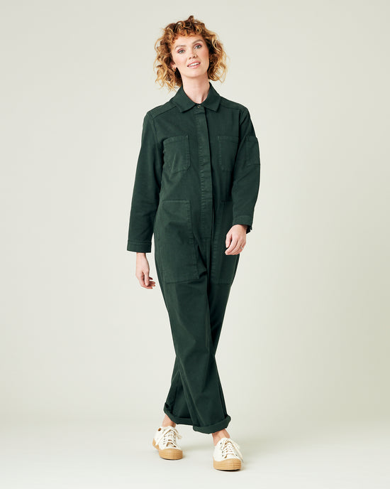 model wears bottle green coverall