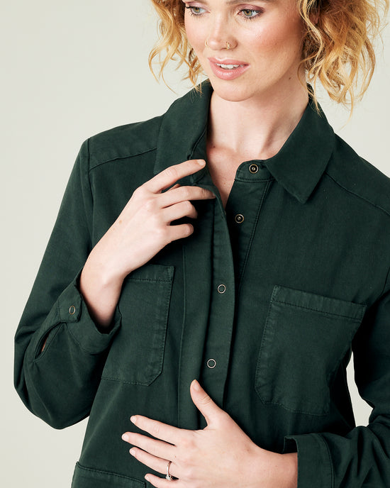 model wears bottle green coverall