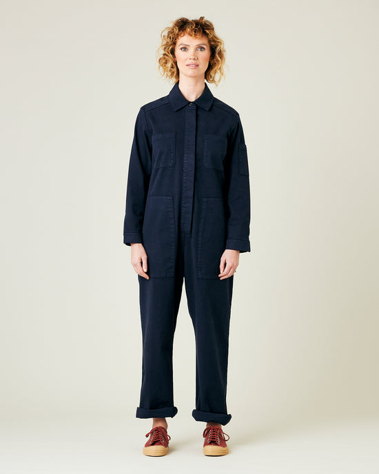 model wears navy coverall 