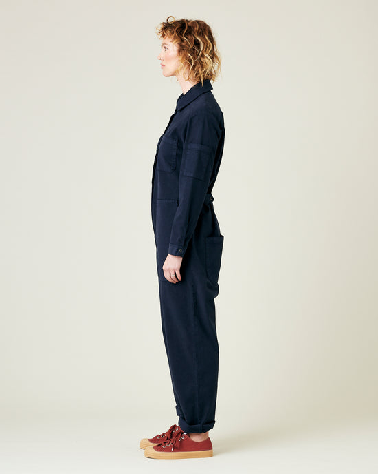 model wears navy coverall 