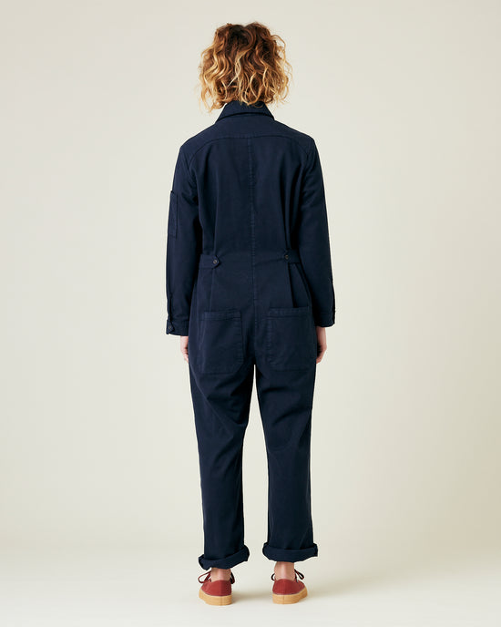 model wears navy coverall 