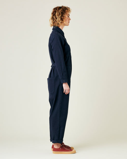 model wears navy coverall 