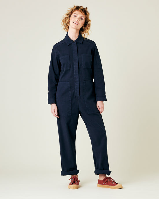 model wears navy coverall 