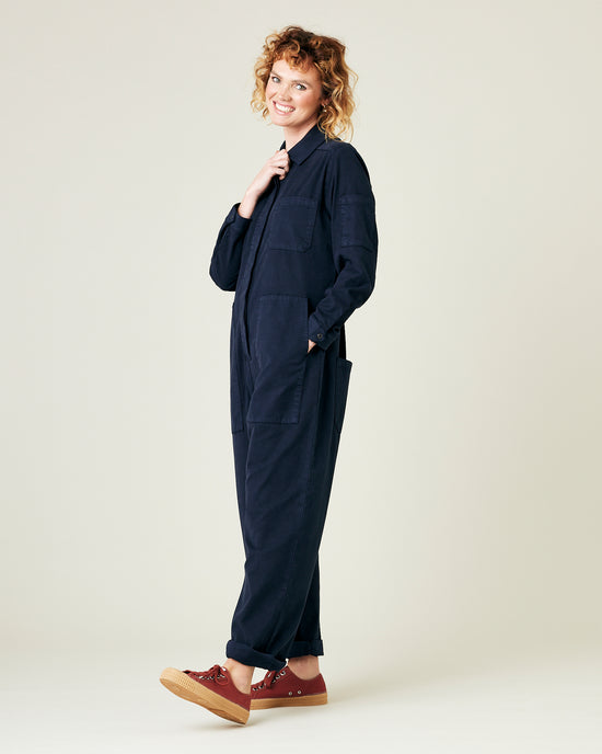 model wears navy coverall 