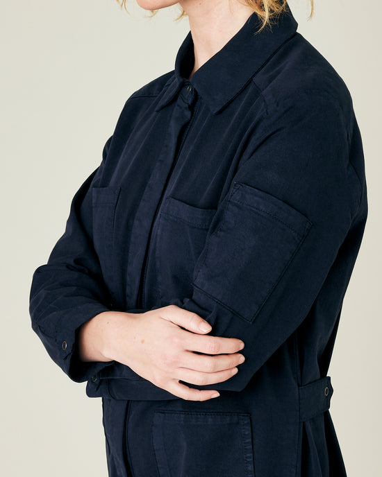 model wears navy coverall 