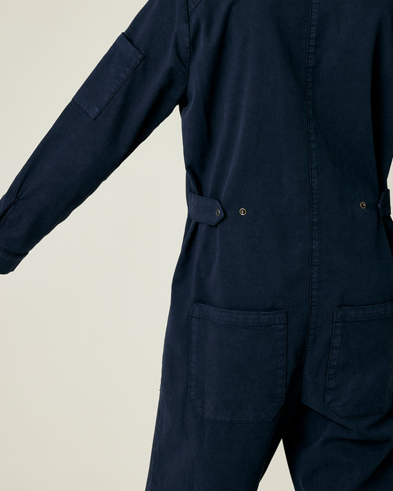 model wears navy coverall 