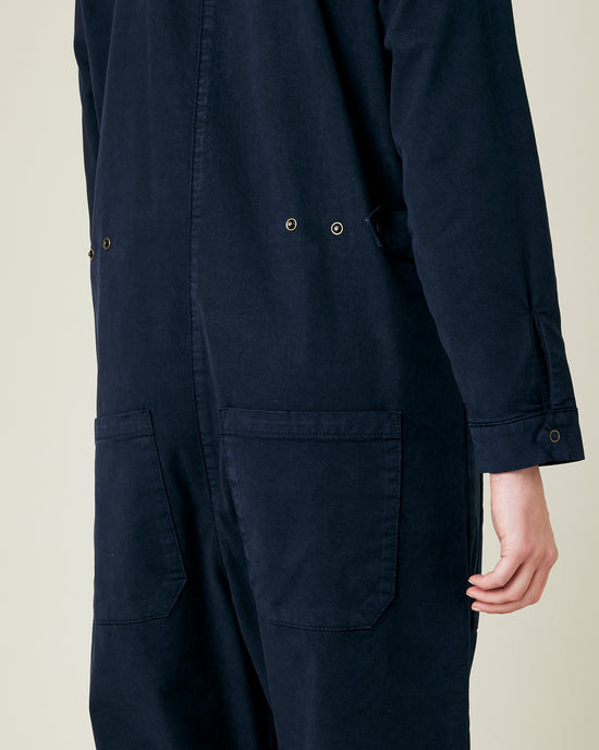 model wears navy coverall 