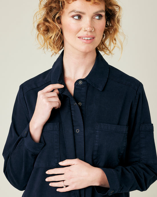 model wears navy coverall 