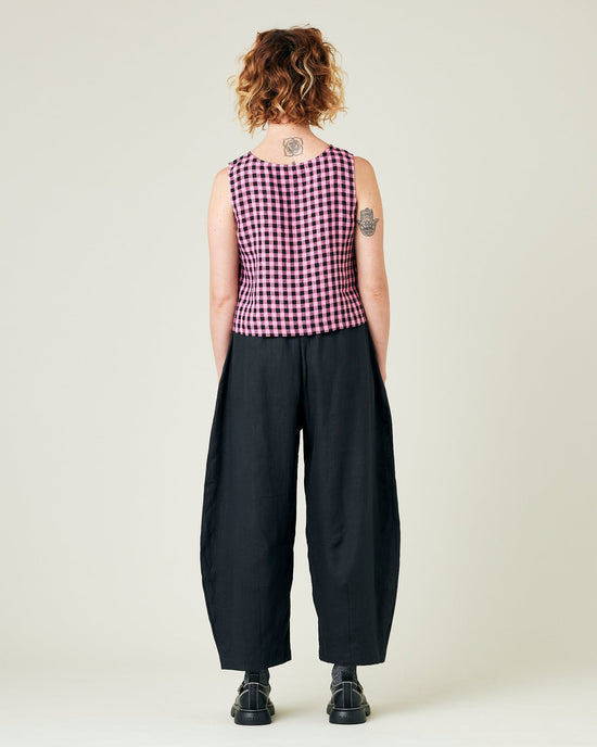 model wears black daisy linen trousers