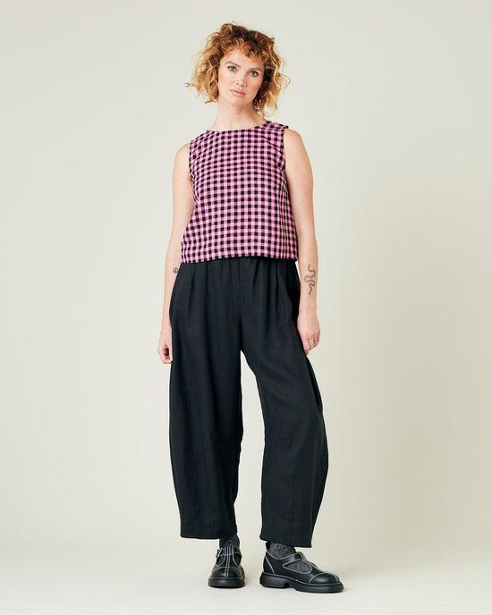 model wears black daisy linen trousers