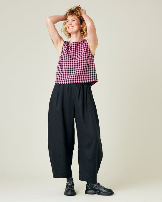 model wears black daisy linen trousers 