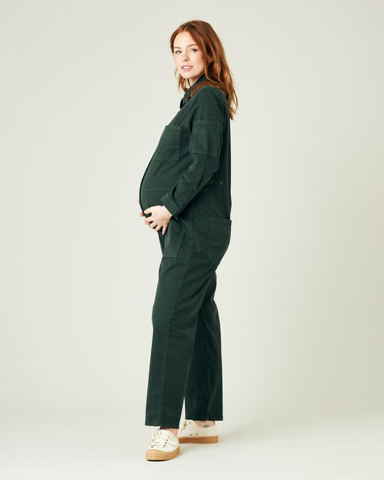 pregnant model wears bottle green coverall