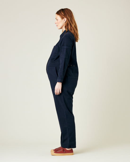 pregnant model wears navy coverall 