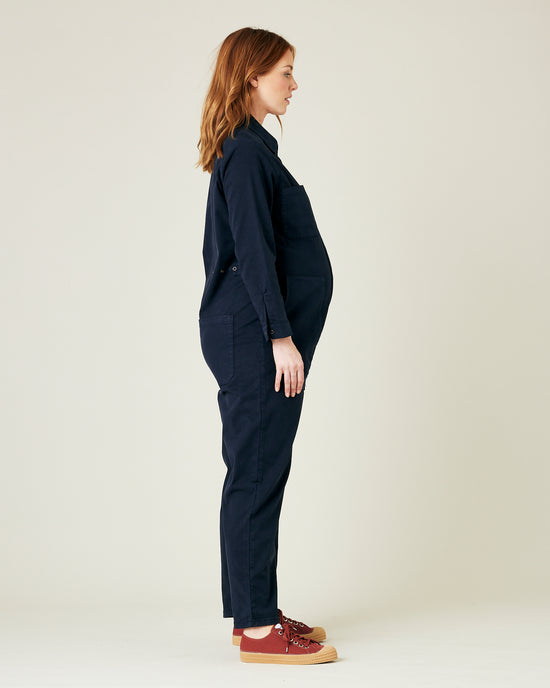 pregnant model wears navy coverall 