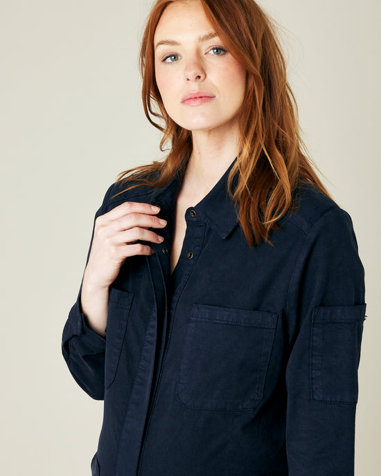 pregnant model wears navy coverall 