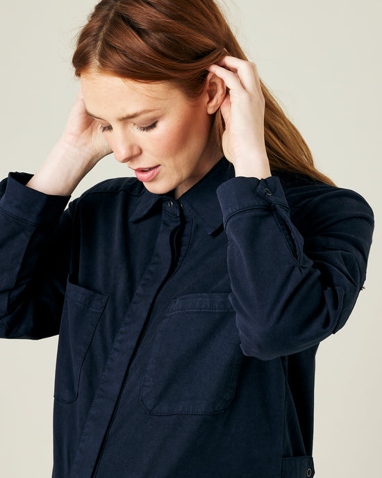 pregnant model wears navy coverall 