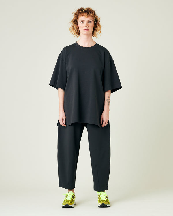 model wears slate jersey huxley trousers