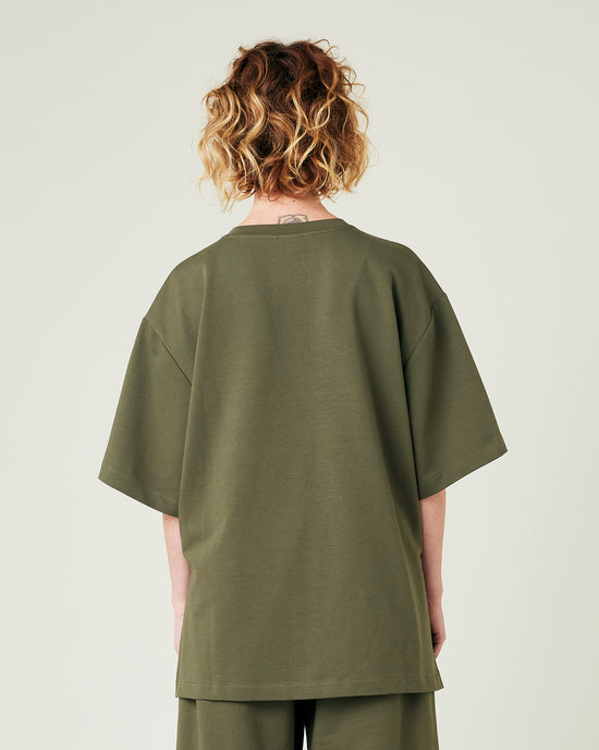 model wears olive jersey jude top