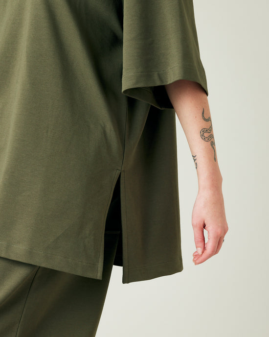 model wears olive jersey jude top