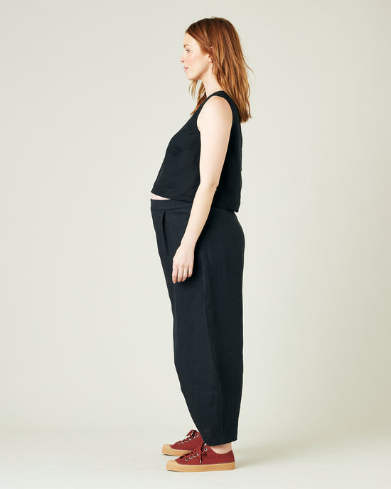 pregnant model wears black daisy linen trousers 