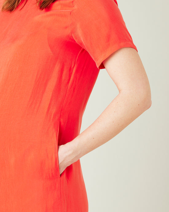 pregnant model wears coral celine jumpsuit